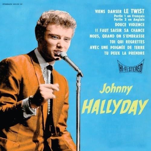 Johnny Hallyday album cover, singer with microphone on blue background.