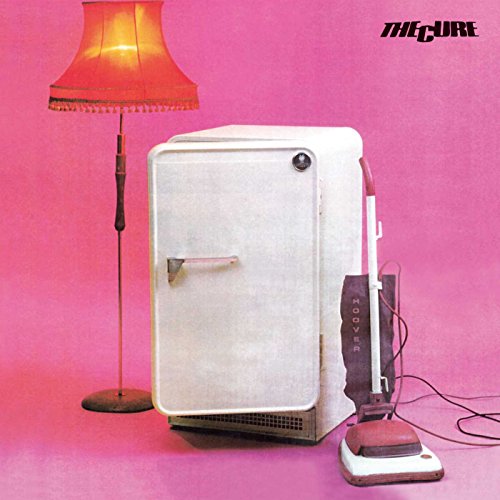 The Cure Three Imaginary Boys album cover featuring a lamp, refrigerator, and vacuum cleaner.