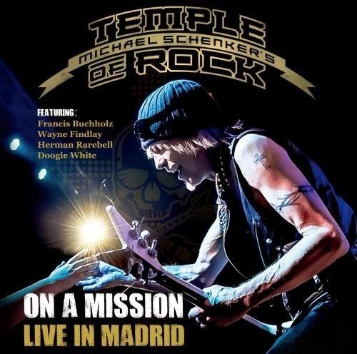 Michael Schenker playing guitar live in Madrid, album cover art.