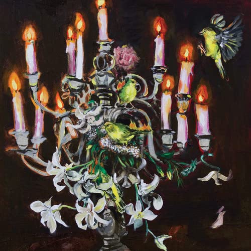 Painted candelabra with lit candles and several small yellow birds.