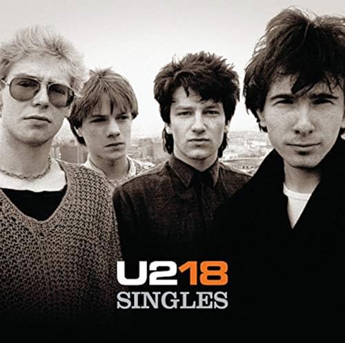 U2 band portrait on album cover for “18 Singles” CD.