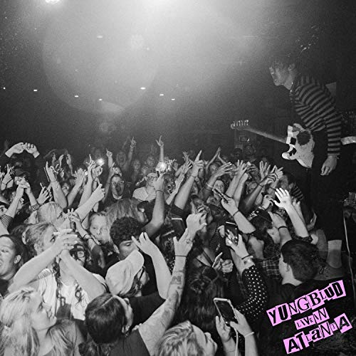 Black and white concert photo of Yungblud performing to a crowd.