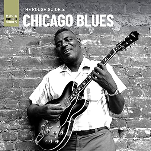 Black and white album cover featuring a smiling musician with a guitar.