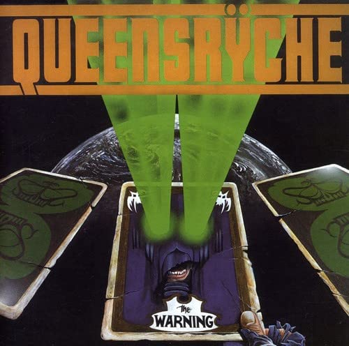 Album cover with green beams, tarot cards, and a purple figure in a box.