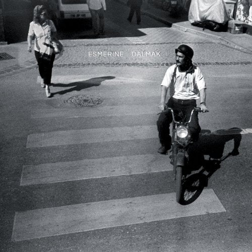 Black and white album cover with a pedestrian and motorcyclist.