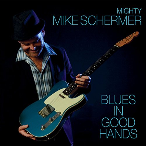 Man with guitar, album cover for Mighty Mike Schermer’s “Blues In Good Hands.”