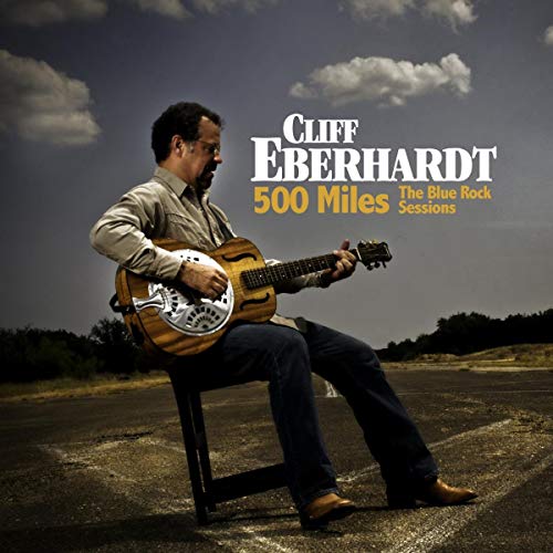 Cliff Eberhardt playing a resonator guitar outdoors, album cover art.