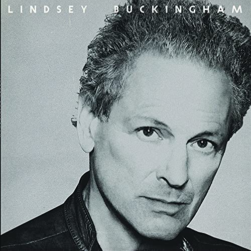 Black and white portrait of Lindsey Buckingham, close-up, album cover.
