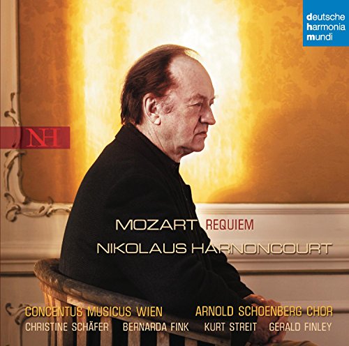 Nikolaus Harnoncourt sits in a chair in front of a gold wall on this album.