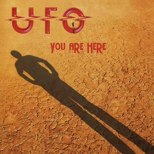 UFO album cover: red logo, shadow figure on cracked earth.
