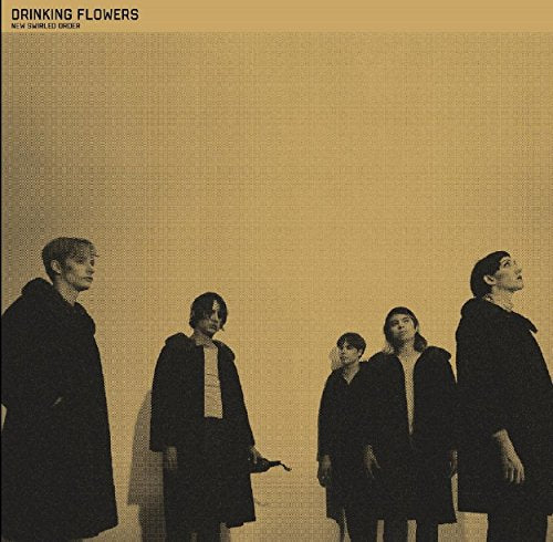 CD cover with four figures in dark coats against a textured, tan background.