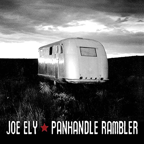 Black and white album cover featuring a vintage travel trailer in a landscape.