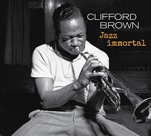 Black and white photo of Clifford Brown playing a trumpet, album cover.