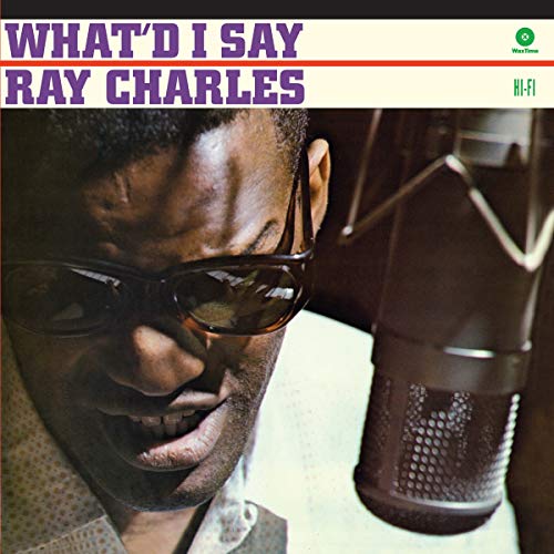 Ray Charles at a microphone, wearing sunglasses, album cover.