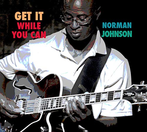 Norman Johnson playing a red electric guitar, album cover art.