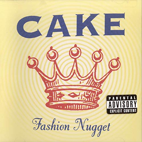 Yellow CD cover with "CAKE" text, a crown, and parental advisory label.