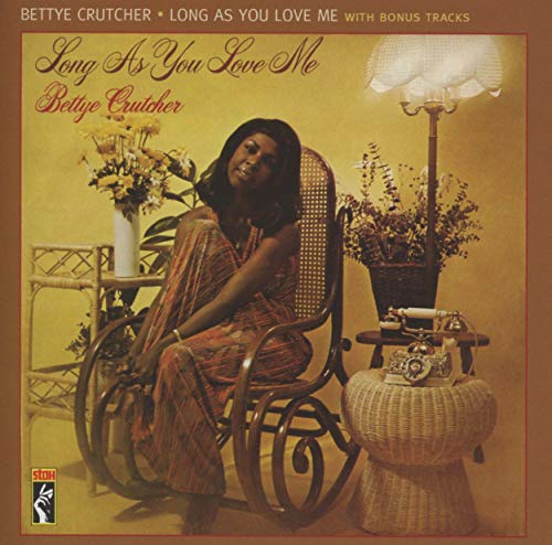 Bettye Crutcher album cover: woman in chair with floral arrangements.