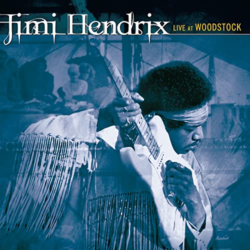 Jimi Hendrix playing guitar with a headband, album cover for “Live At Woodstock.”
