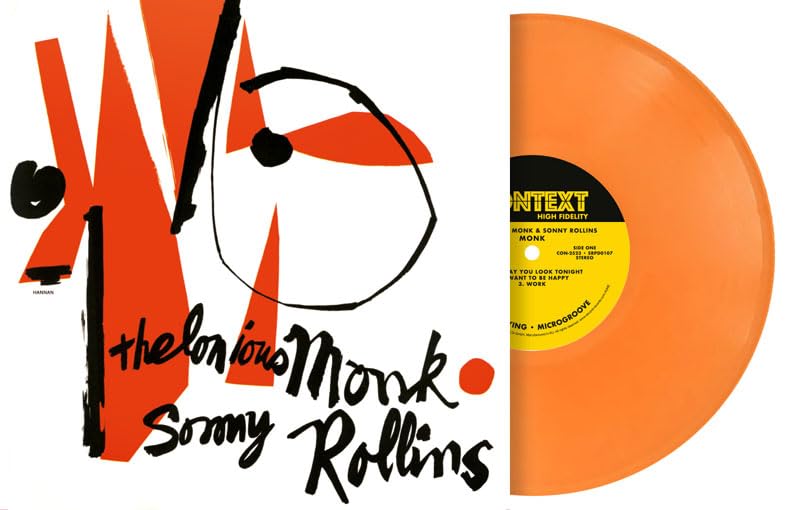 Orange vinyl record with abstract black and white cover art, featuring text.