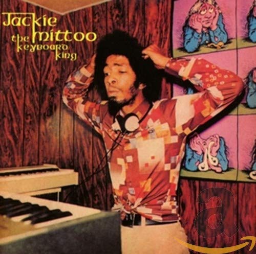 CD cover featuring Jackie Mittoo, a keyboardist, in colorful patterned clothing.