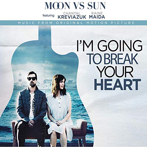 Vinyl album cover featuring a couple by the sea and a guitar.