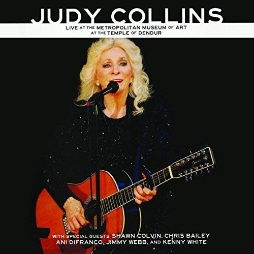 Judy Collins performing with a guitar, dark background, CD & DVD package.