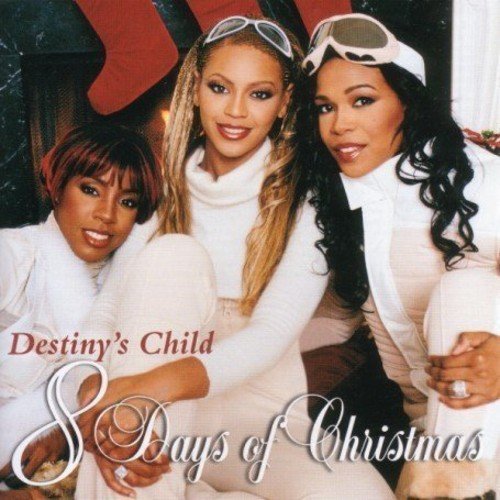 Destiny's Child members wearing white winter clothing and ski goggles on a CD cover.