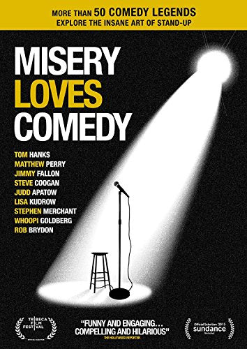 Misery Loves Comedy" DVD cover with a spotlight on a microphone and stool.