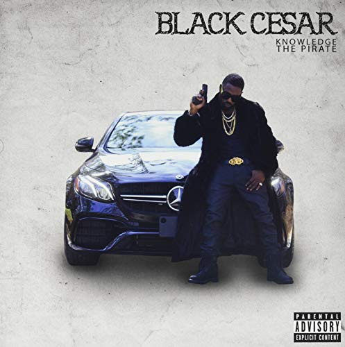 Album cover featuring a man with a gun leaning on a black car.