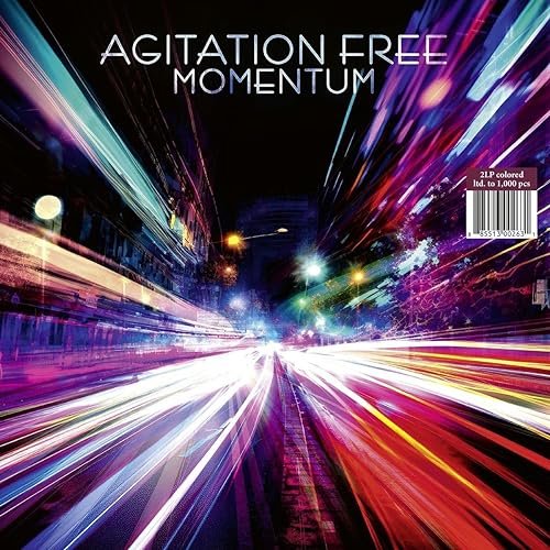 Vinyl record cover for “Momentum” by Agitation Free, with blurred city lights.