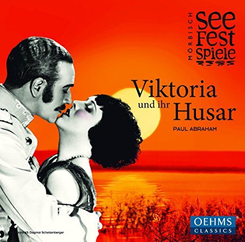 CD cover: couple embracing against a vibrant orange and red sunset.