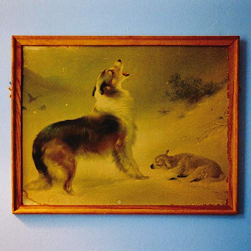 Vinyl record cover depicting a howling dog in a snowy landscape.