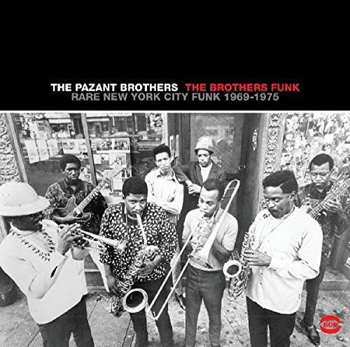 Black and white photo of a funk band, The Pazant Brothers, playing instruments.