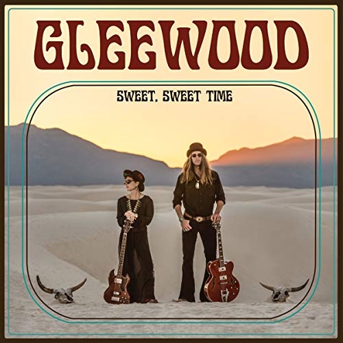 CD cover featuring two musicians in a desert landscape with guitars and skulls.