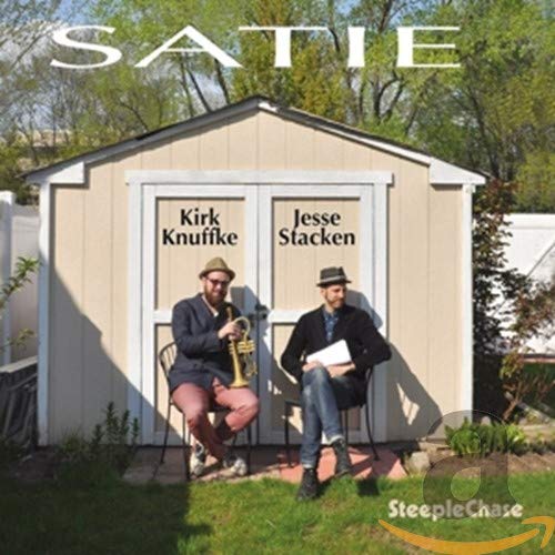 CD cover: two musicians with instruments in front of a shed.
