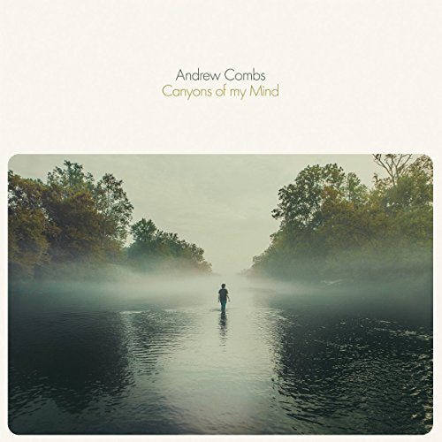 Album cover: misty landscape with a lone figure by water.