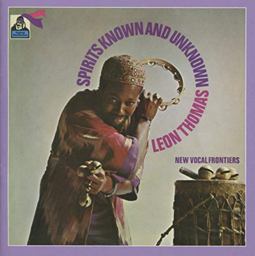 CD cover: musician with tambourine, percussion instruments, purple and brown tones.