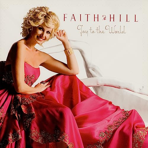 Faith Hill album cover, “Joy To The World,” featuring a smiling woman in red.
