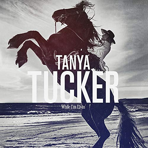 Tanya Tucker album cover: woman on rearing black horse, beach background.