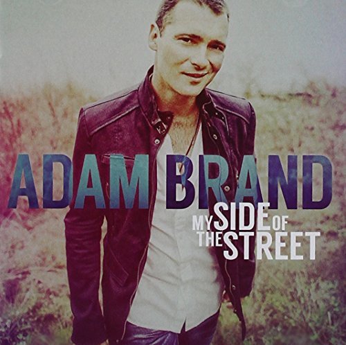 CD cover featuring Adam Brand in a leather jacket, album title visible.