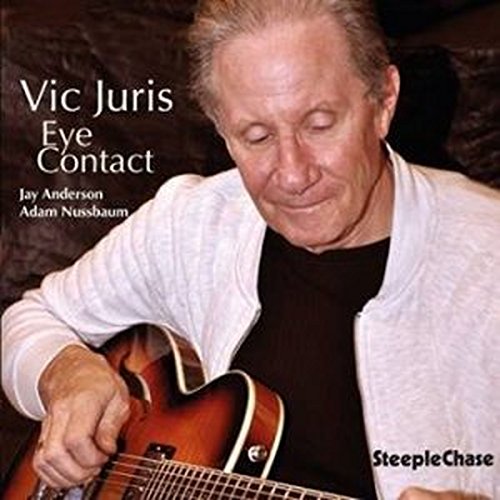 Vic Juris playing a guitar on the "Eye Contact" CD cover.