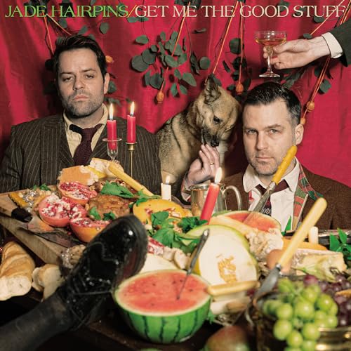 Album cover with two men, a dog, and a lavish spread of food.
