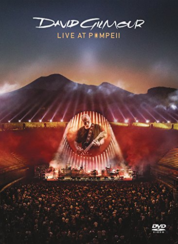 David Gilmour performing live at Pompeii with a large crowd.