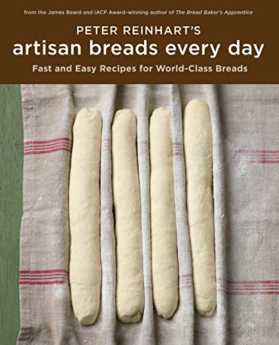 Book cover featuring four loaves of shaped bread on linen fabric.