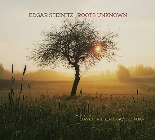 CD cover: lone tree silhouetted against a golden sunset field.