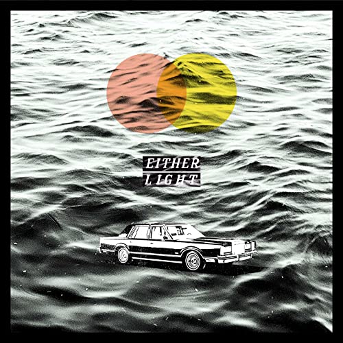 A black and white photo of a car floating on water with overlapping colored circles.