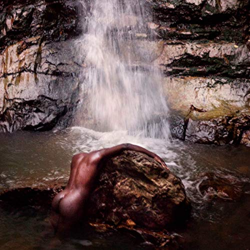 CD cover: nude figure rests near a waterfall and rocks.