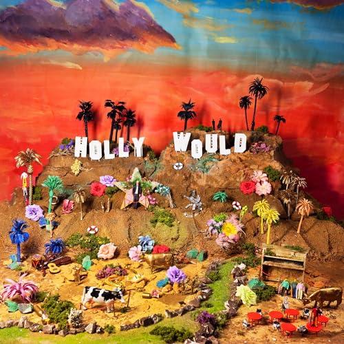 Diorama of a hillside with HOLLY WOULD lettering, palm trees, flowers, and toy animals.