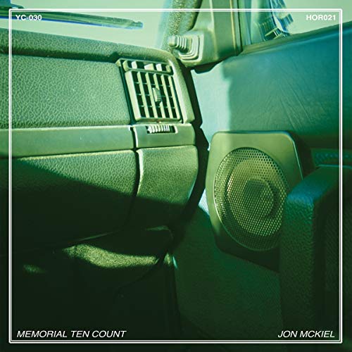 Dark green vinyl record cover depicting a car interior, text reads "Memorial Ten Count".