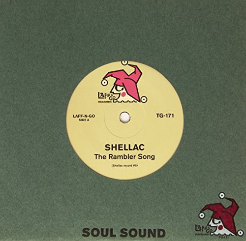 Yellow 7-inch vinyl record with a red cartoon figure and text.